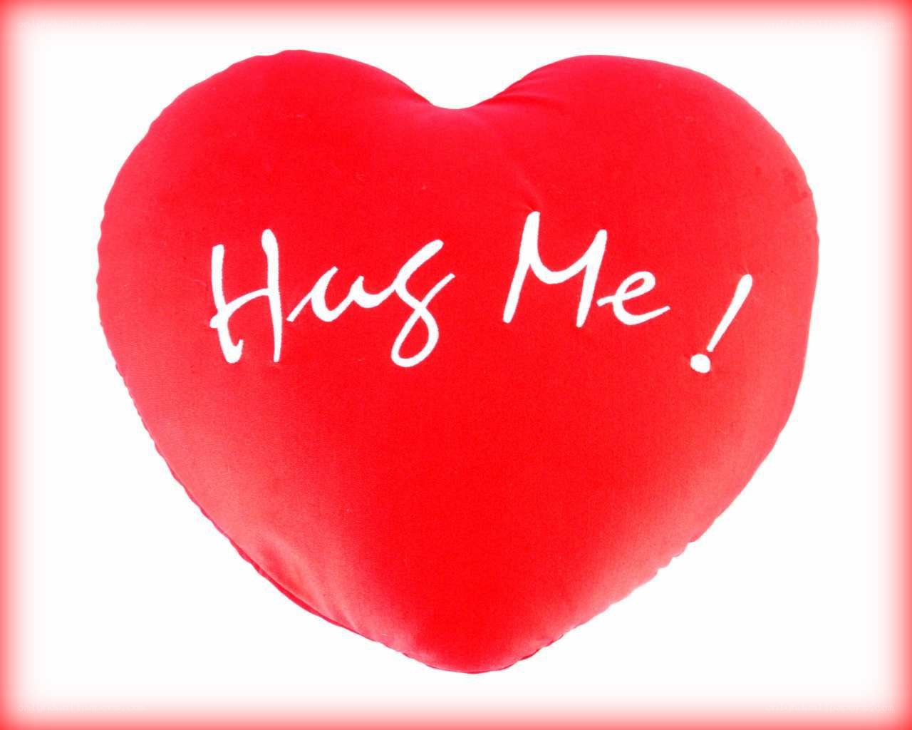 red heart pillow with text