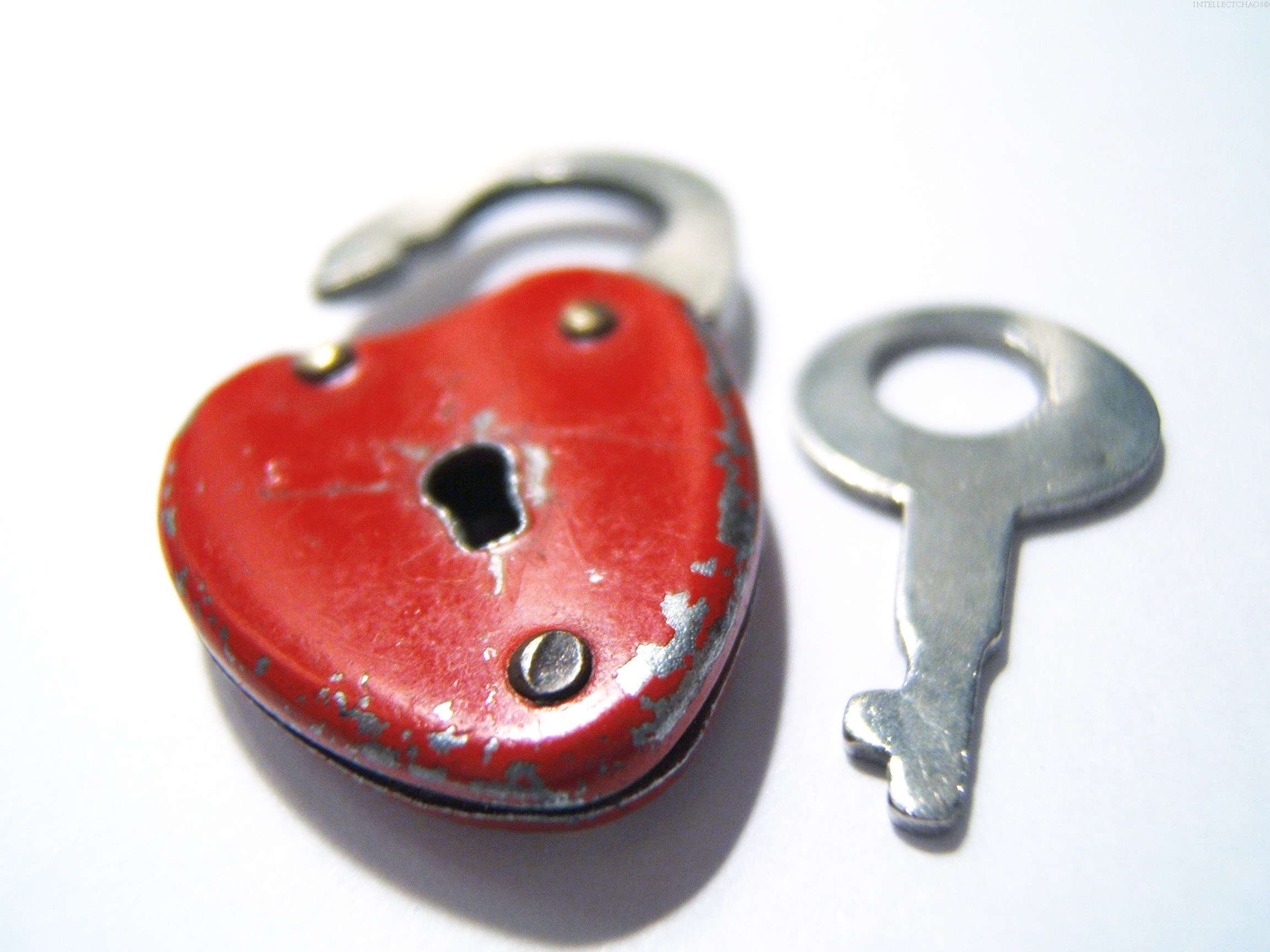 red heart-shaped padlock and key