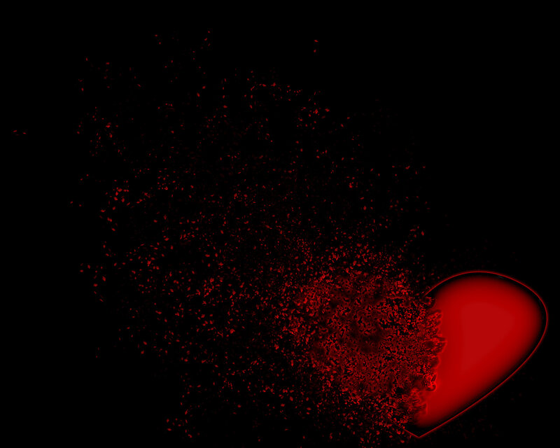 Red heart shattering into pieces