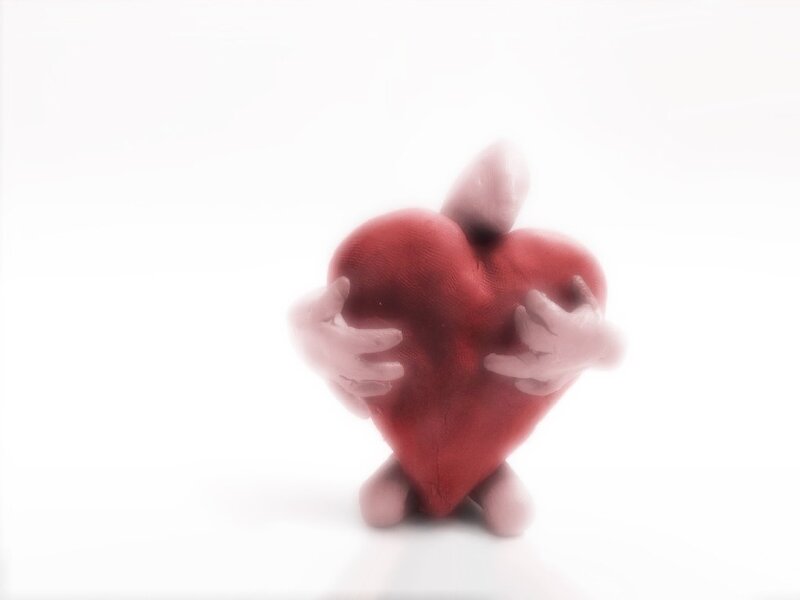 red heart with hands