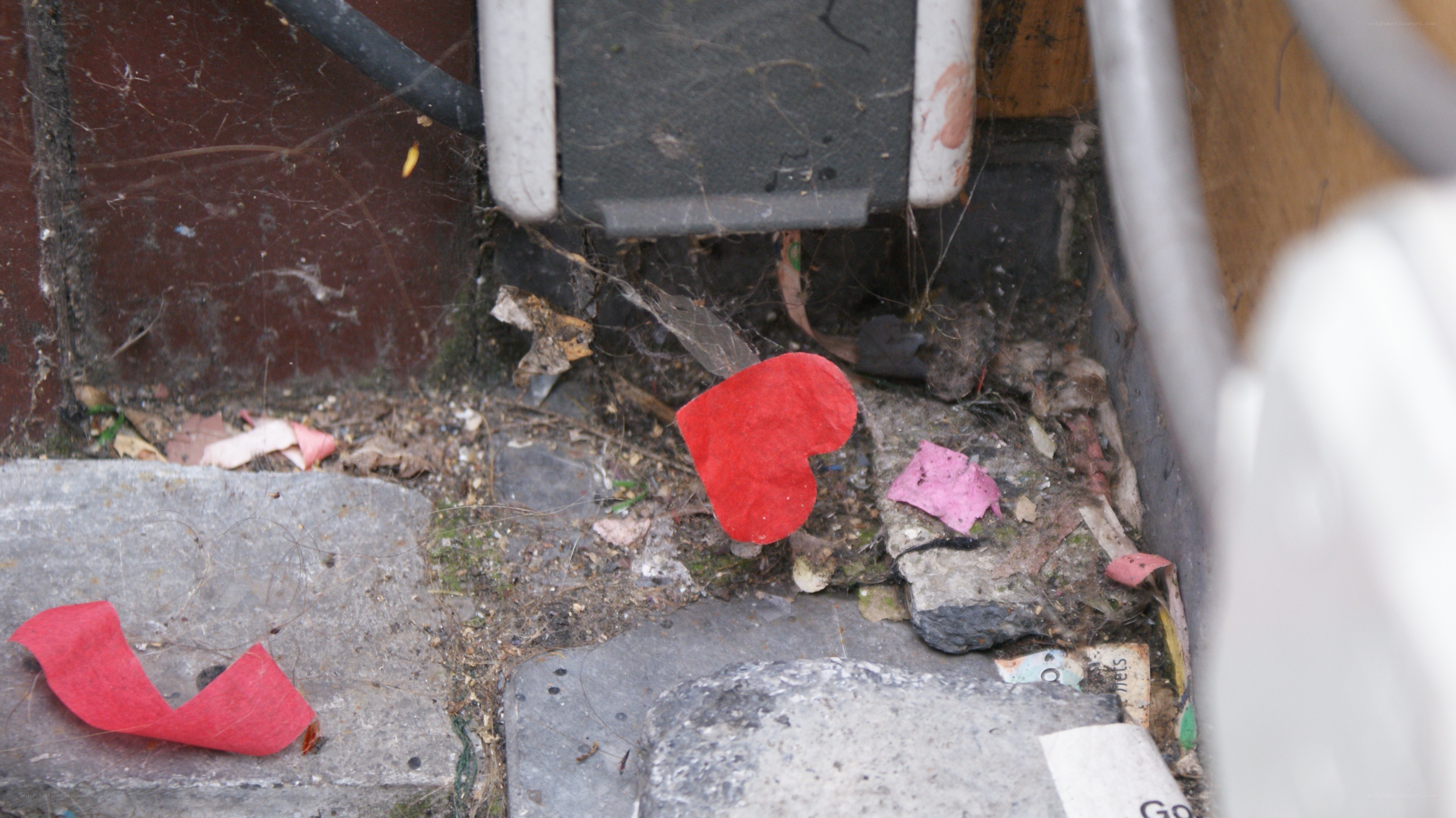 Red hearts in a dirty corner