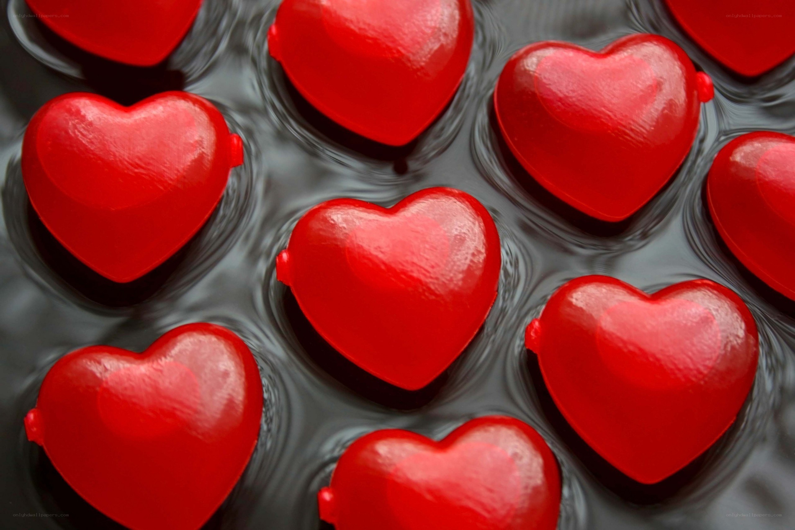 Red hearts on dark surface