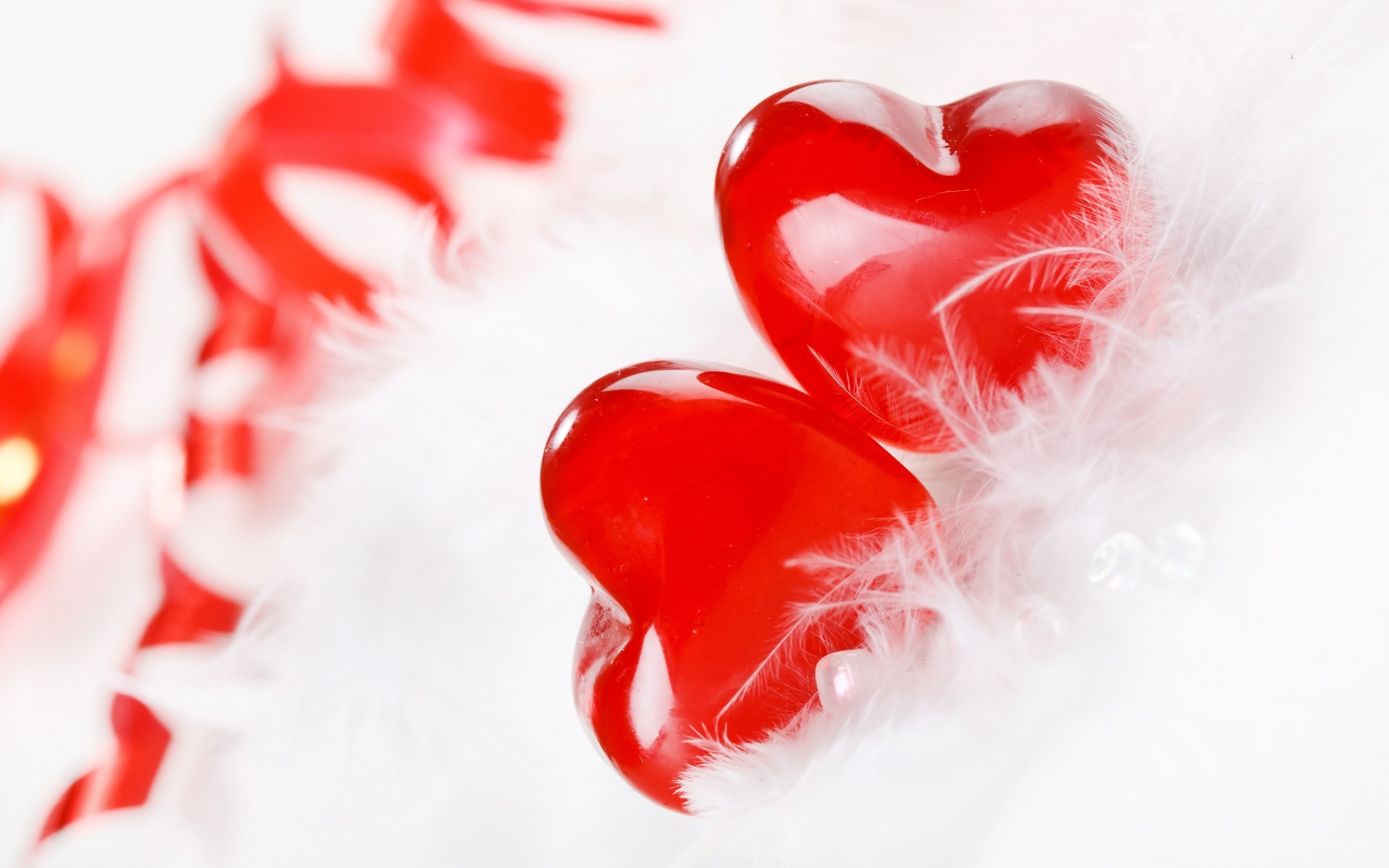 Red hearts on white feathers