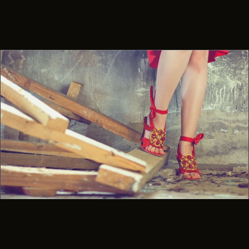 red heels on wooden planks