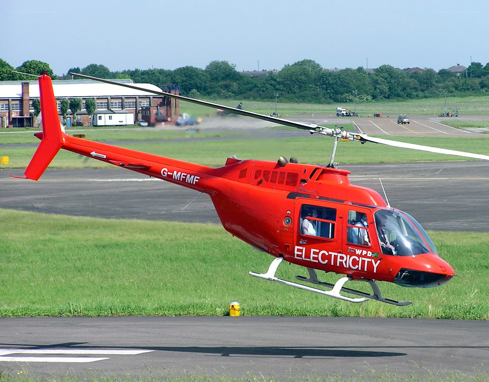 Red helicopter on airfield