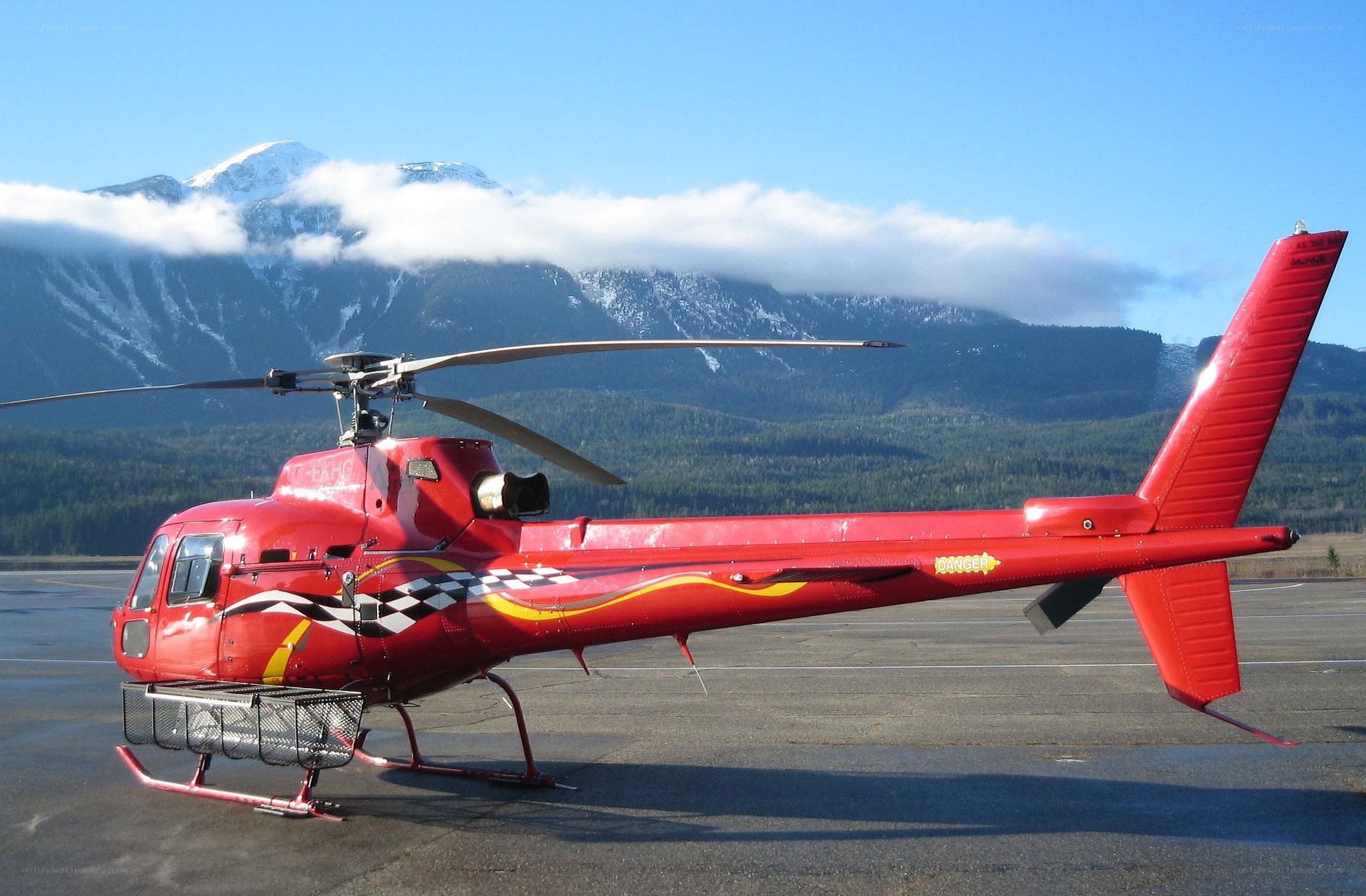 Red helicopter on tarmac