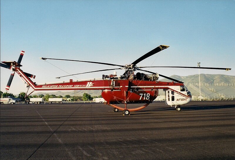 Red Helicopter on Tarmac — Calm, Afternoon