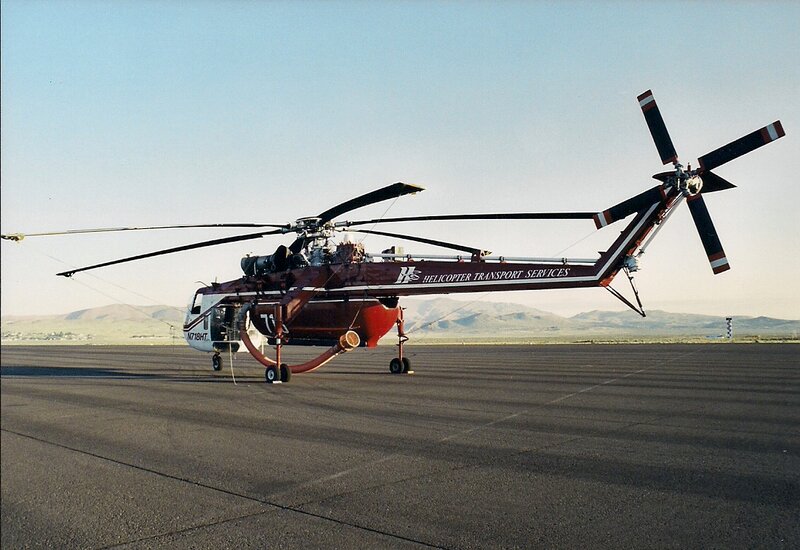 Red Helicopter on Tarmac — Calm