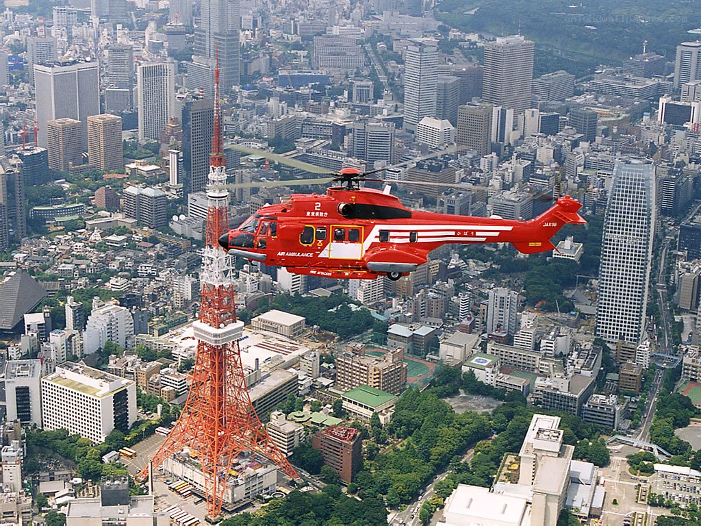 Red helicopter over Tokyo city