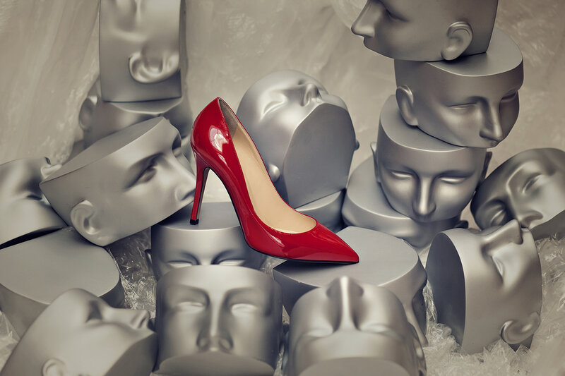 Red High-heeled Shoe — Dramatic, Photograph, Mannequin Heads