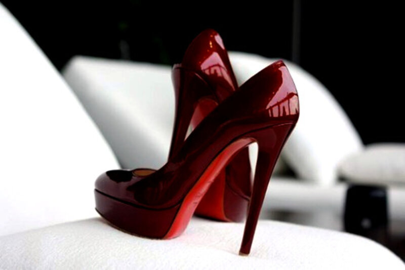 Red High-heeled Shoes — Dramatic, Photograph, White Surface