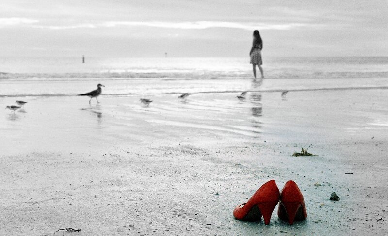 Red High Heels on Beach