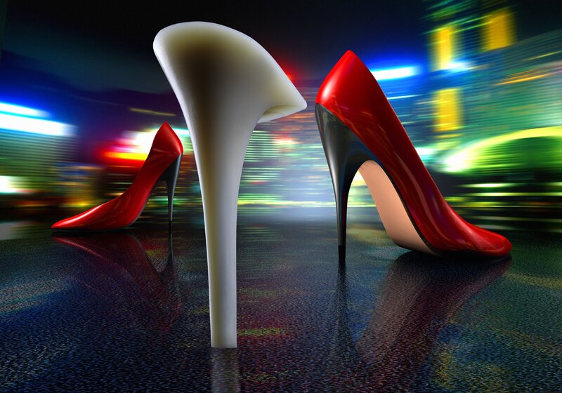 Red high heels on city lights