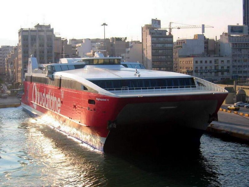 Red high-speed ferry in port