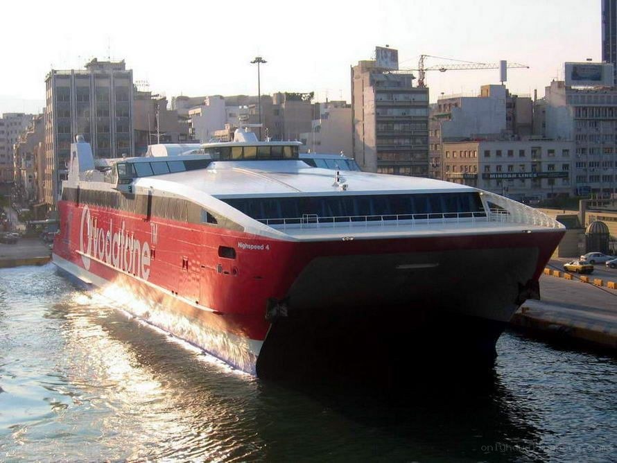 Red high-speed ferry in port