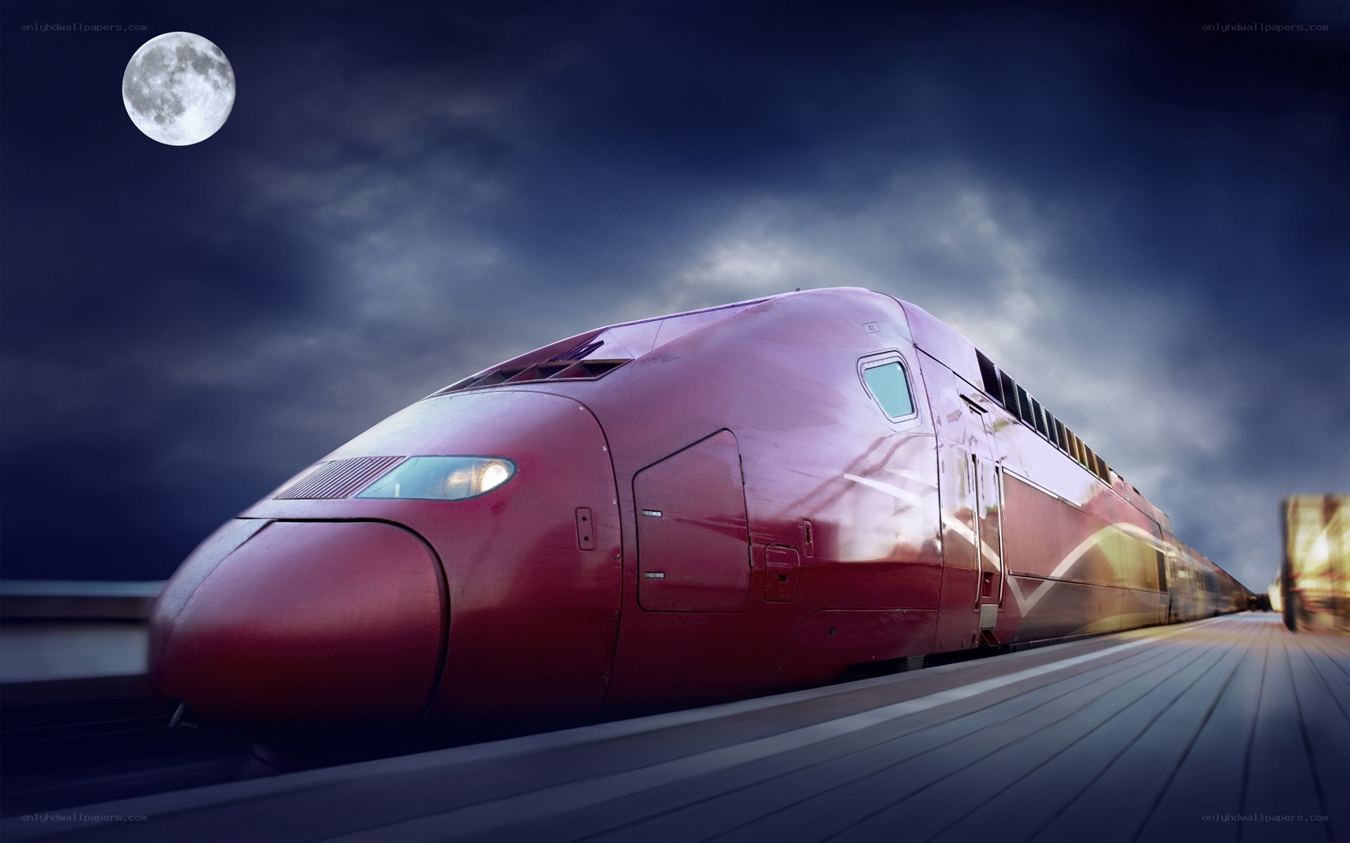 Red high-speed train at night