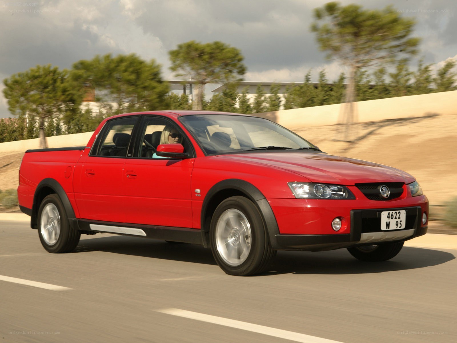 Red Holden Ute in motion