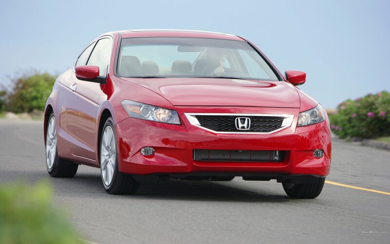 Red Honda Accord driving on road