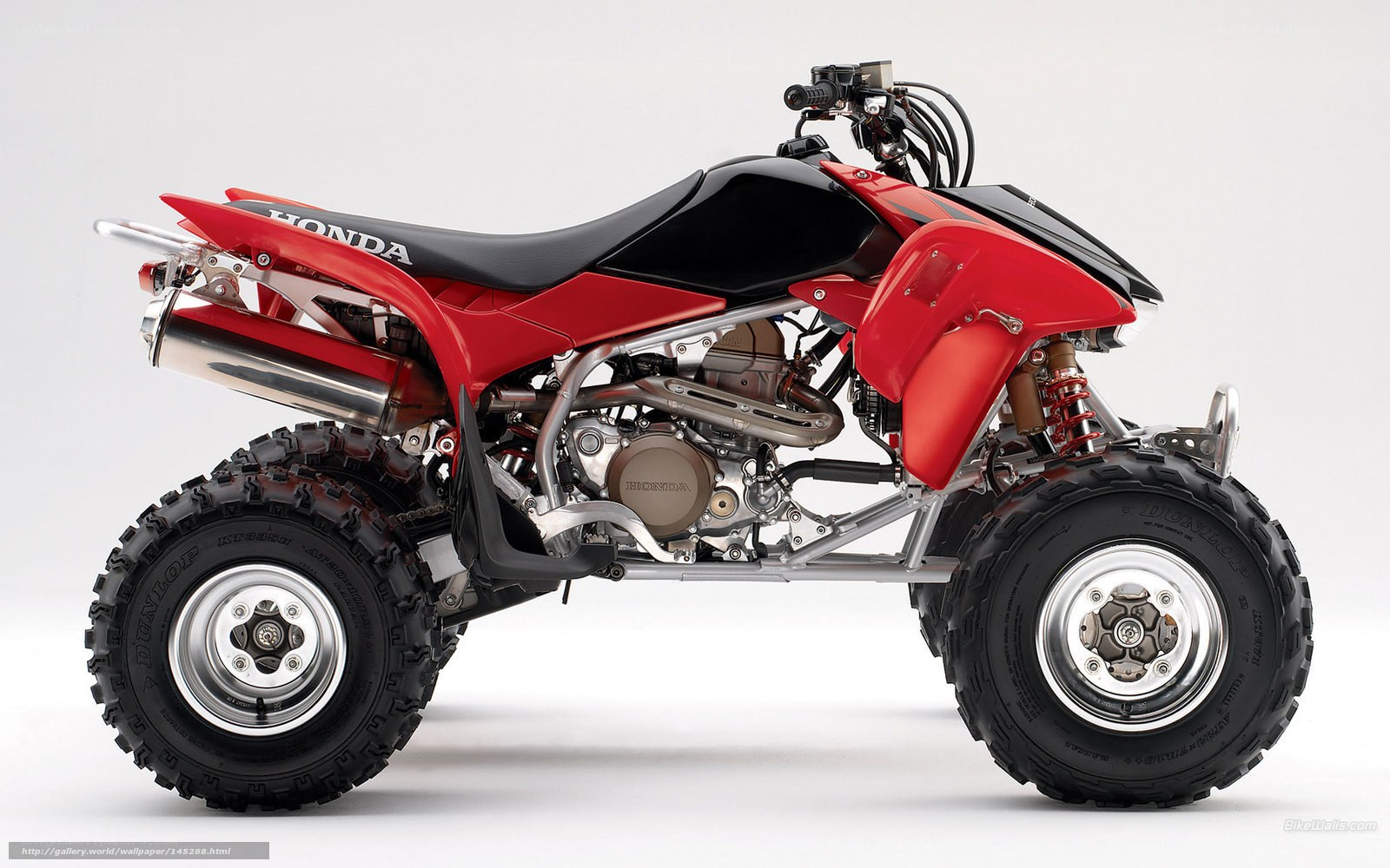 Red Honda ATV side profile