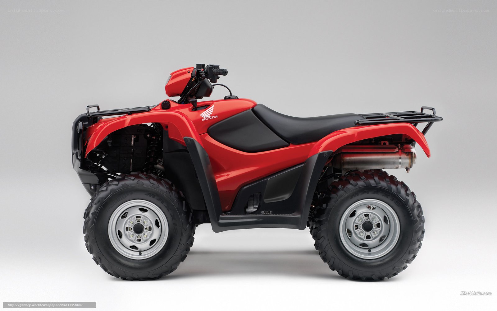 Red Honda ATV side view