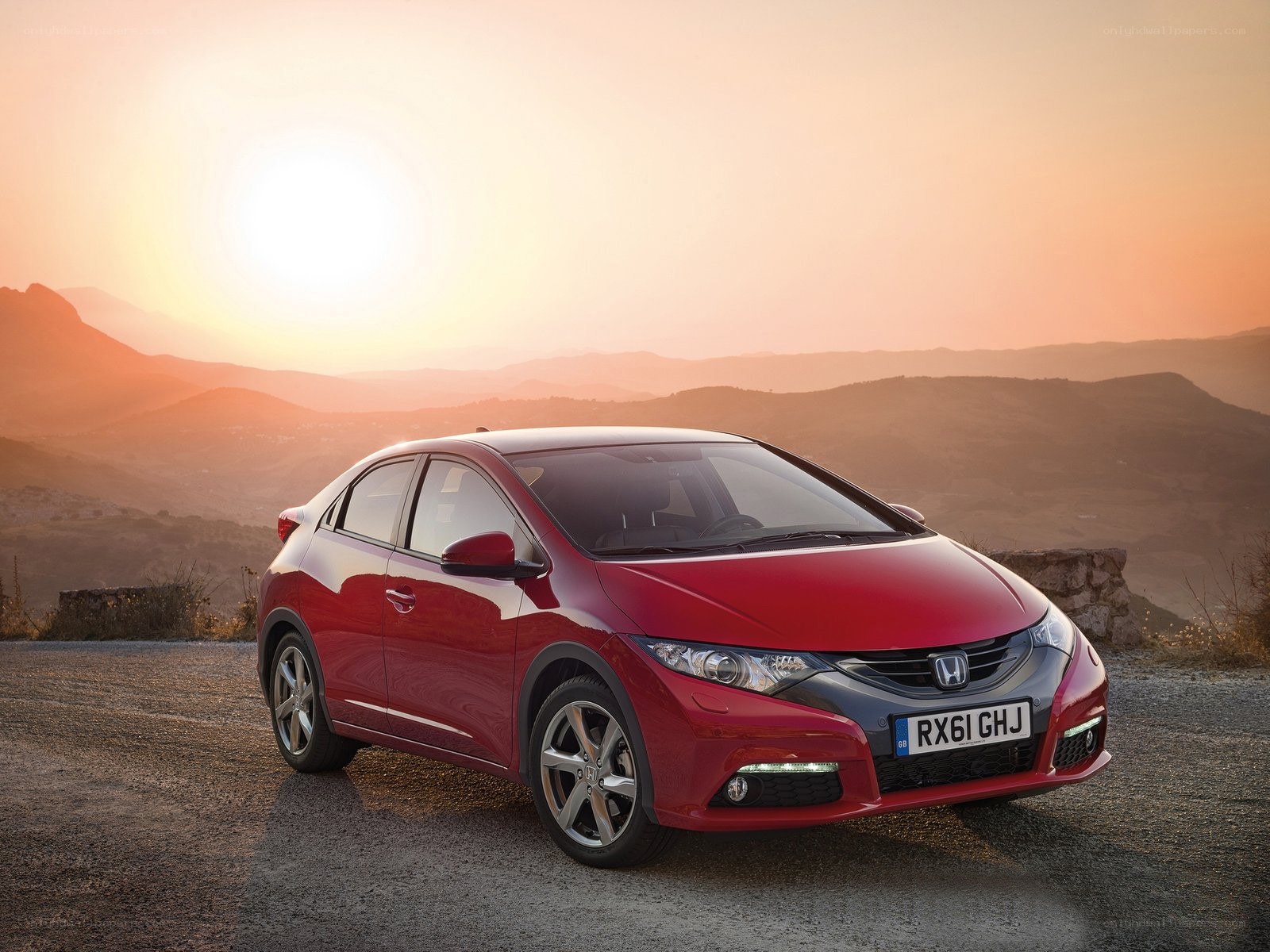 Red Honda Civic at sunset