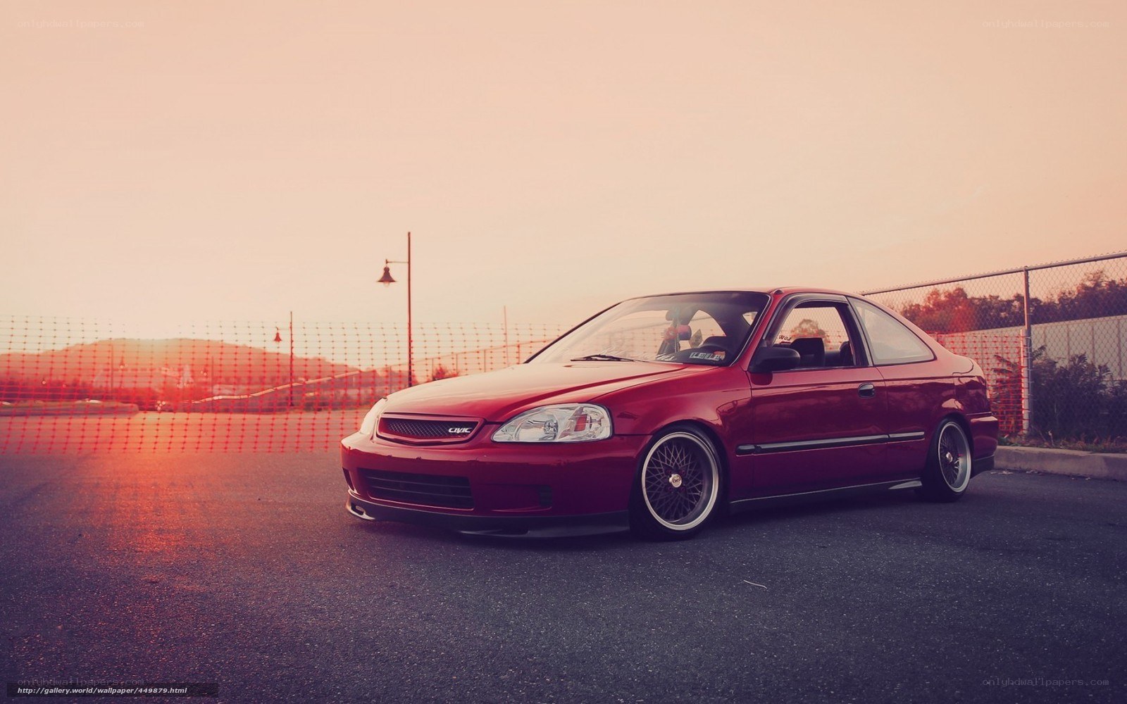 Red Honda Civic at sunset