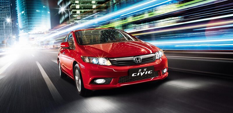 Red Honda Civic in city