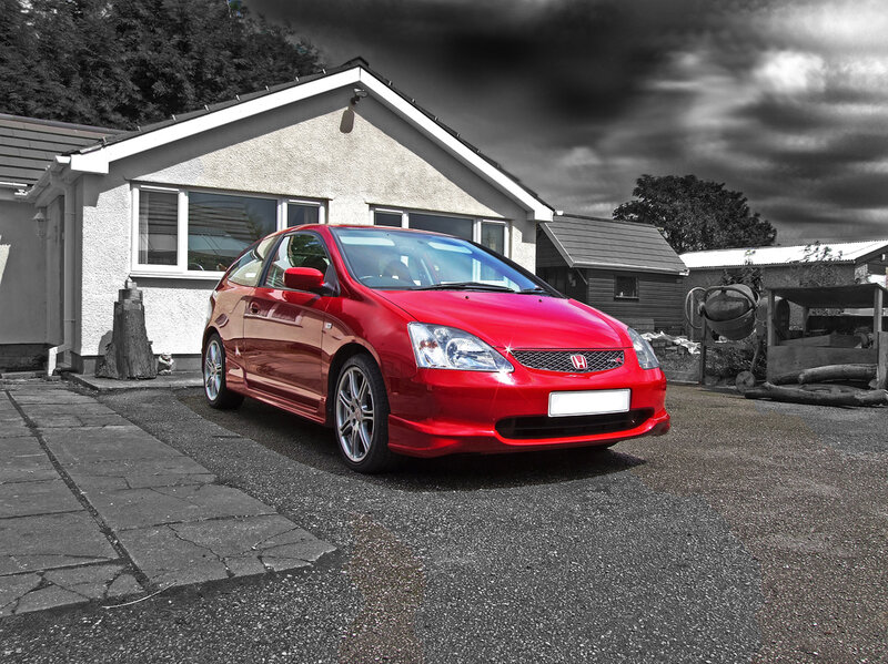 Red Honda Civic in driveway