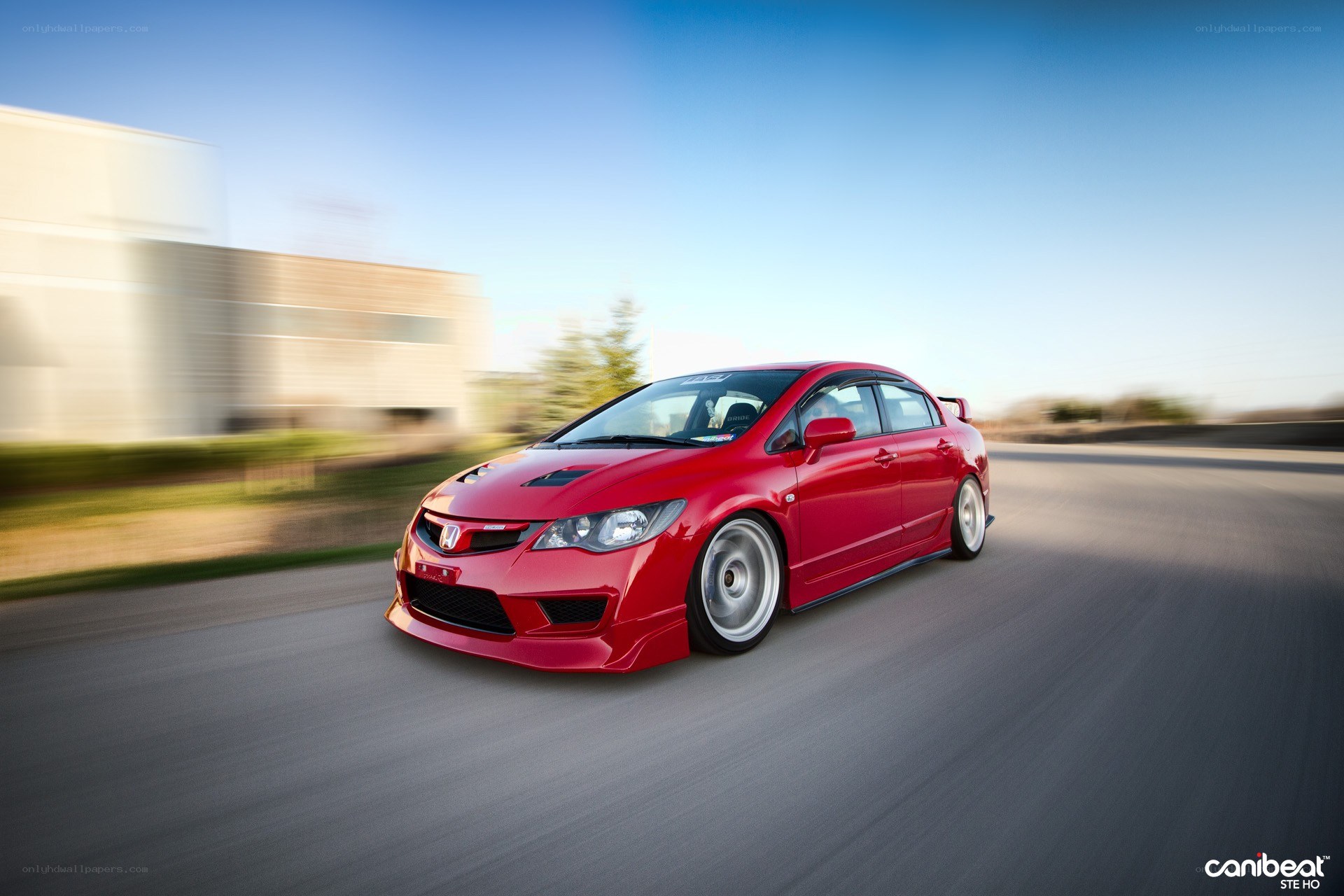 Red Honda Civic in motion