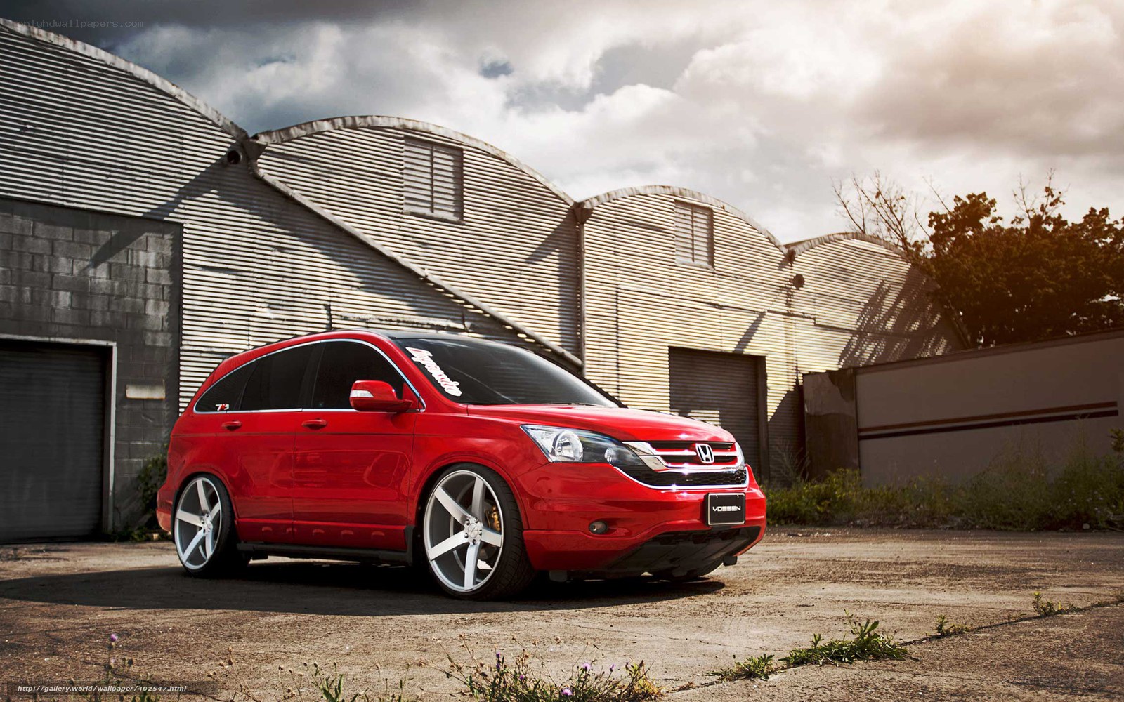 Red Honda CR-V in industrial setting