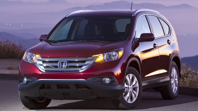 Red Honda CR-V on a mountain road