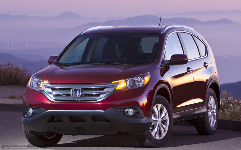 Red Honda CR-V on a mountain road