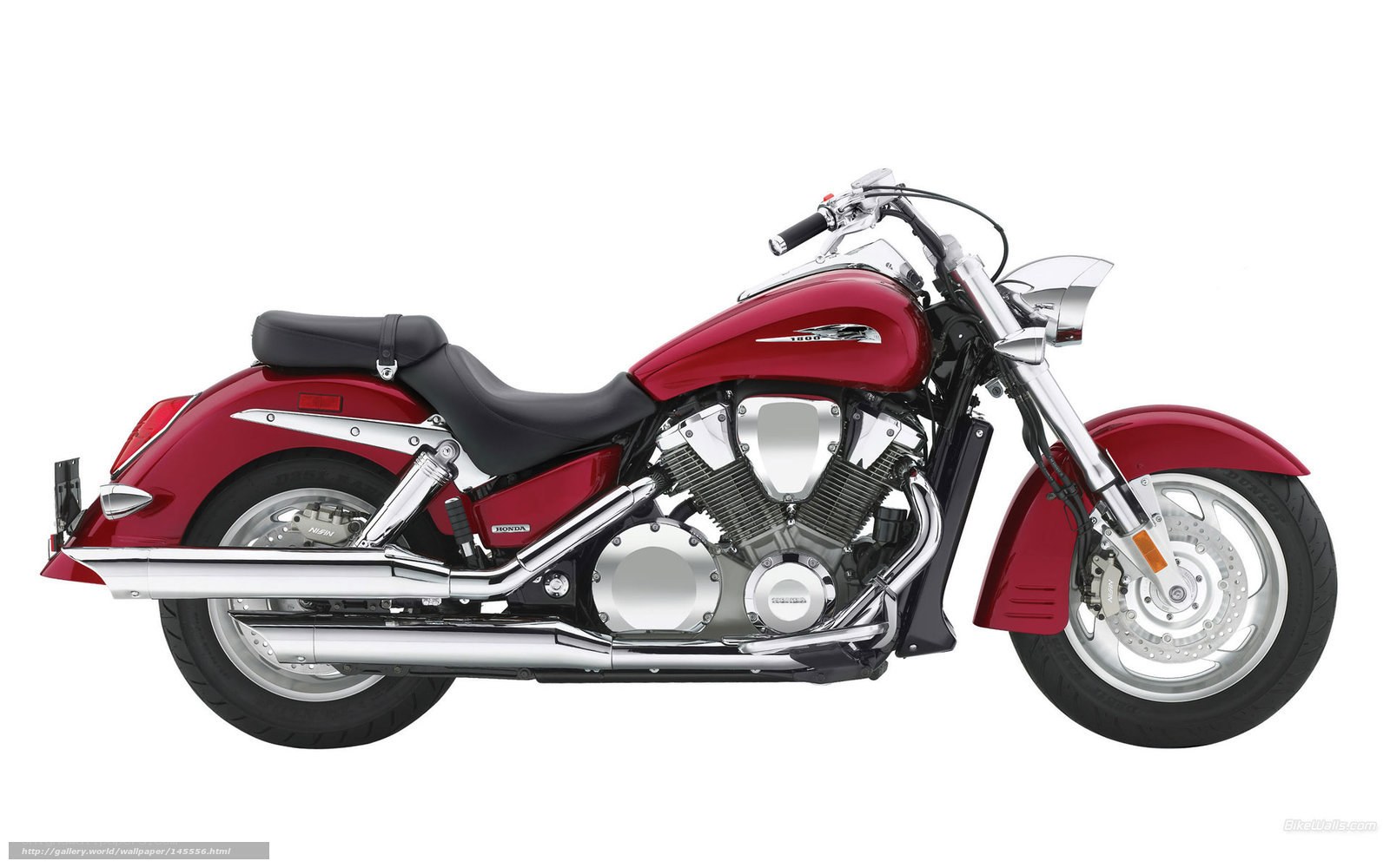 red Honda cruiser motorcycle