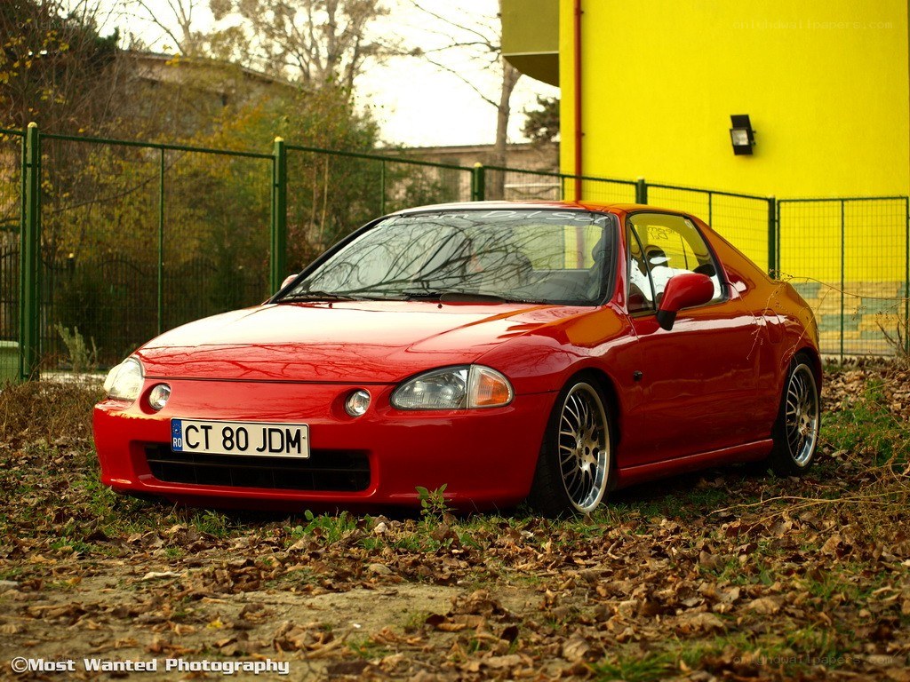 Red Honda CRX parked outside