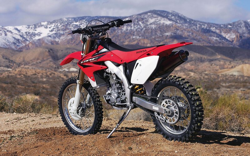 Red Honda dirt bike in desert