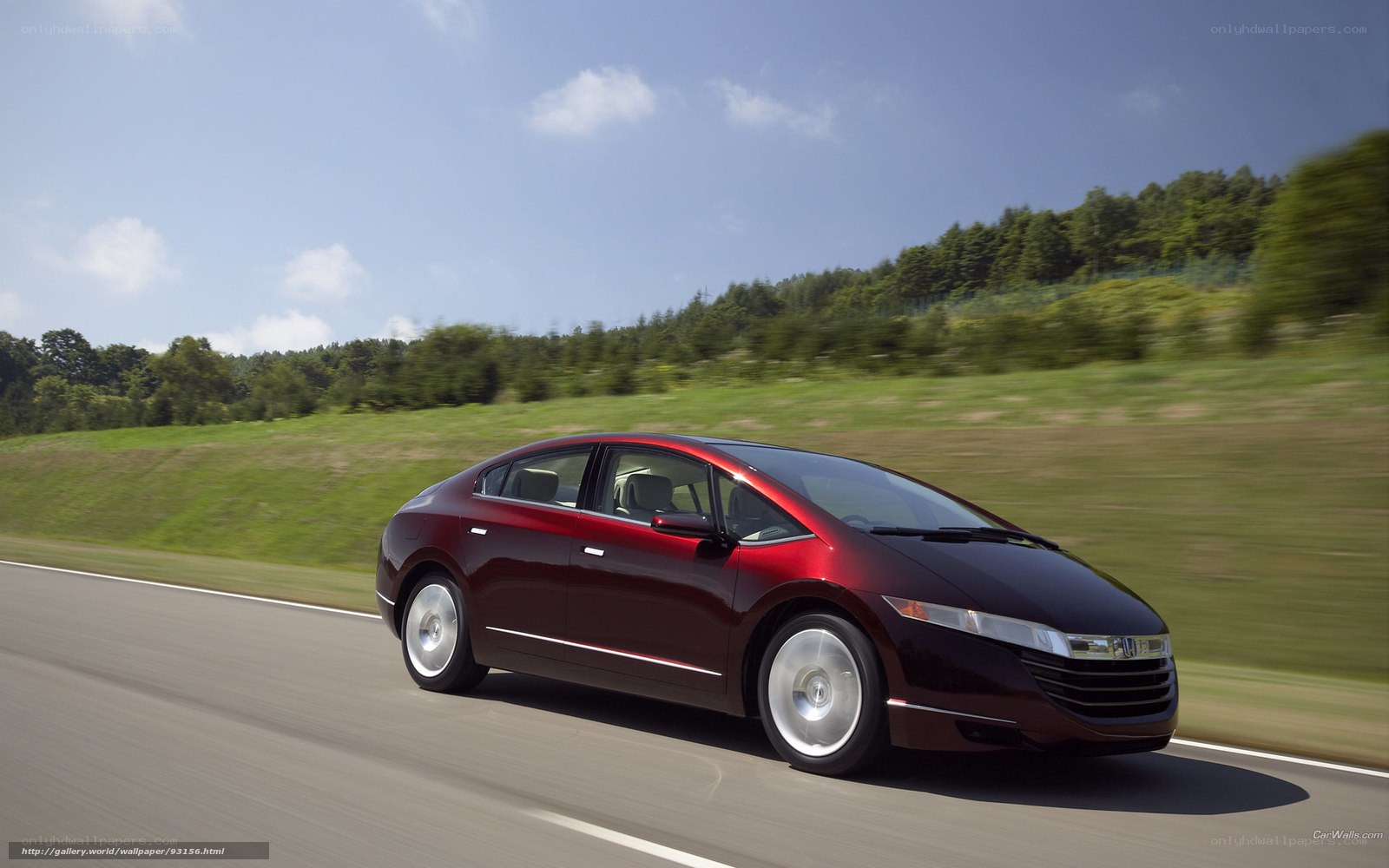 Red Honda FCX Clarity in motion
