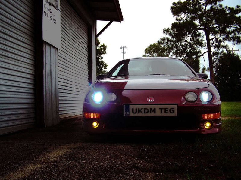 Red Honda Integra parked outside