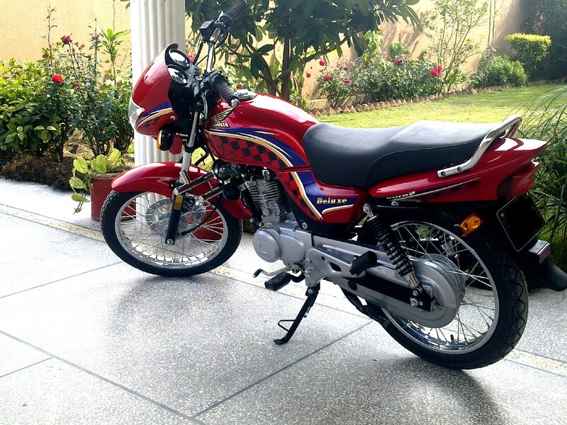 Red Honda Motorcycle — Calm, Afternoon, Photograph