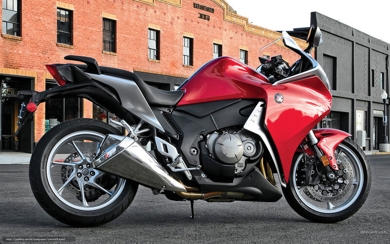 Red Honda motorcycle on street