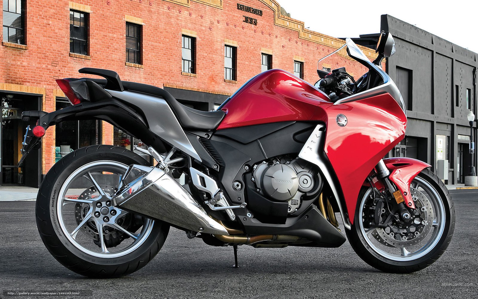 Red Honda motorcycle on street