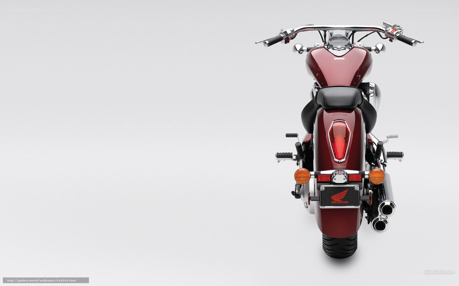 Red Honda motorcycle rear view