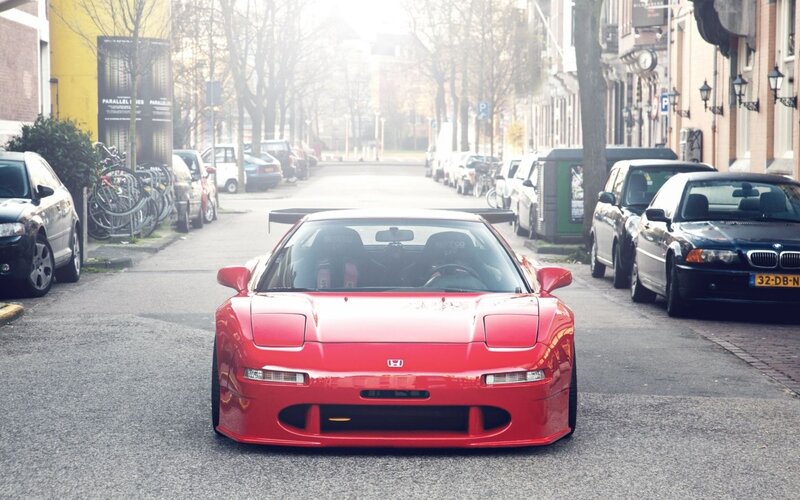 Red Honda NSX on a city street