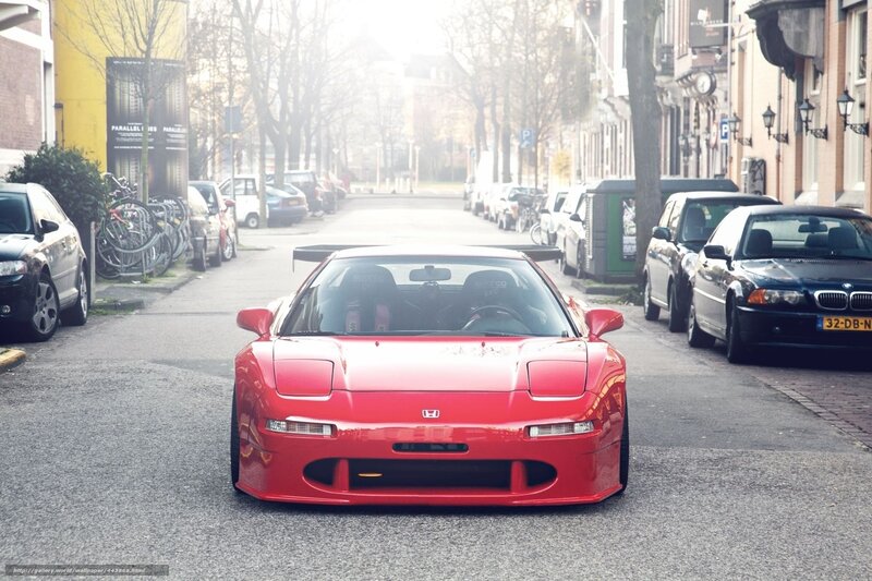 Red Honda NSX on a city street