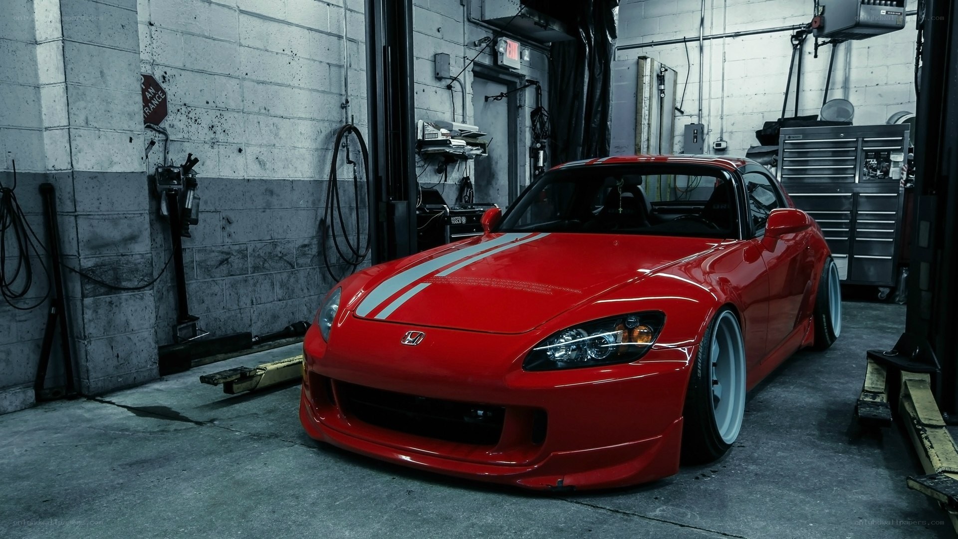 Red Honda S2000 in garage