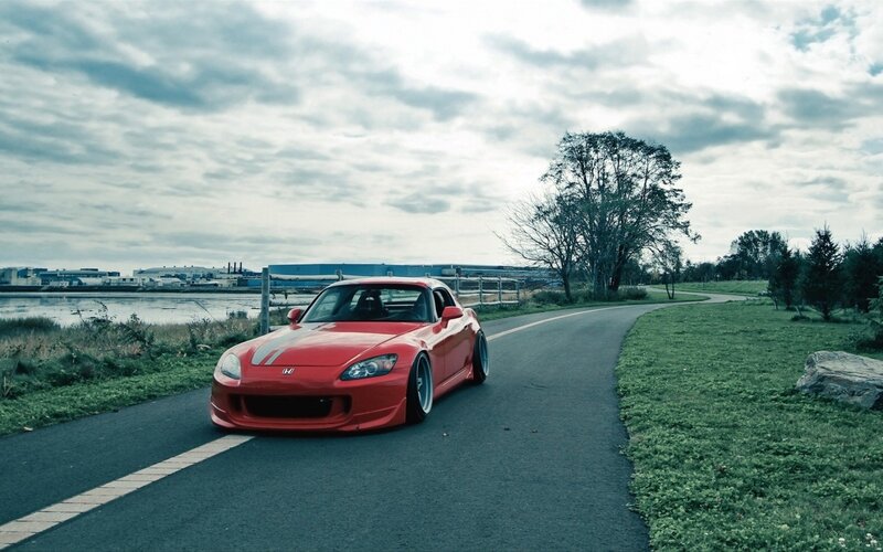 Red Honda S2000 on a coastal road