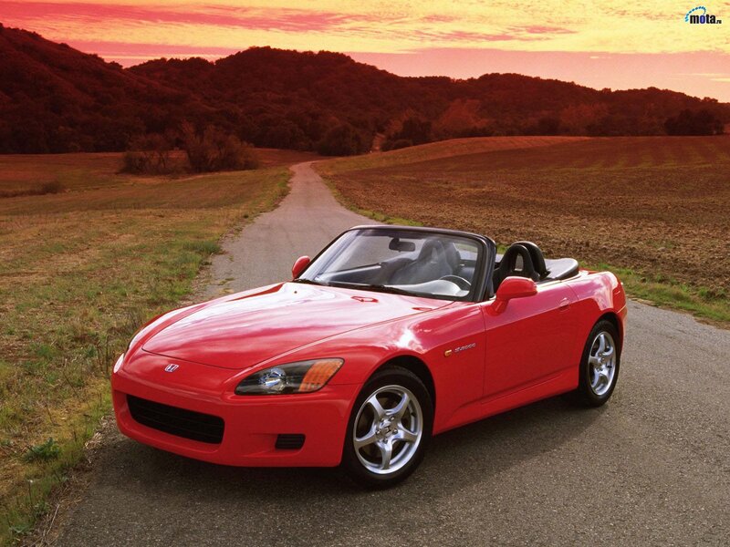 Red Honda S2000 on a country road