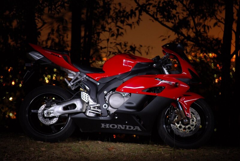 Red Honda sport motorcycle at night