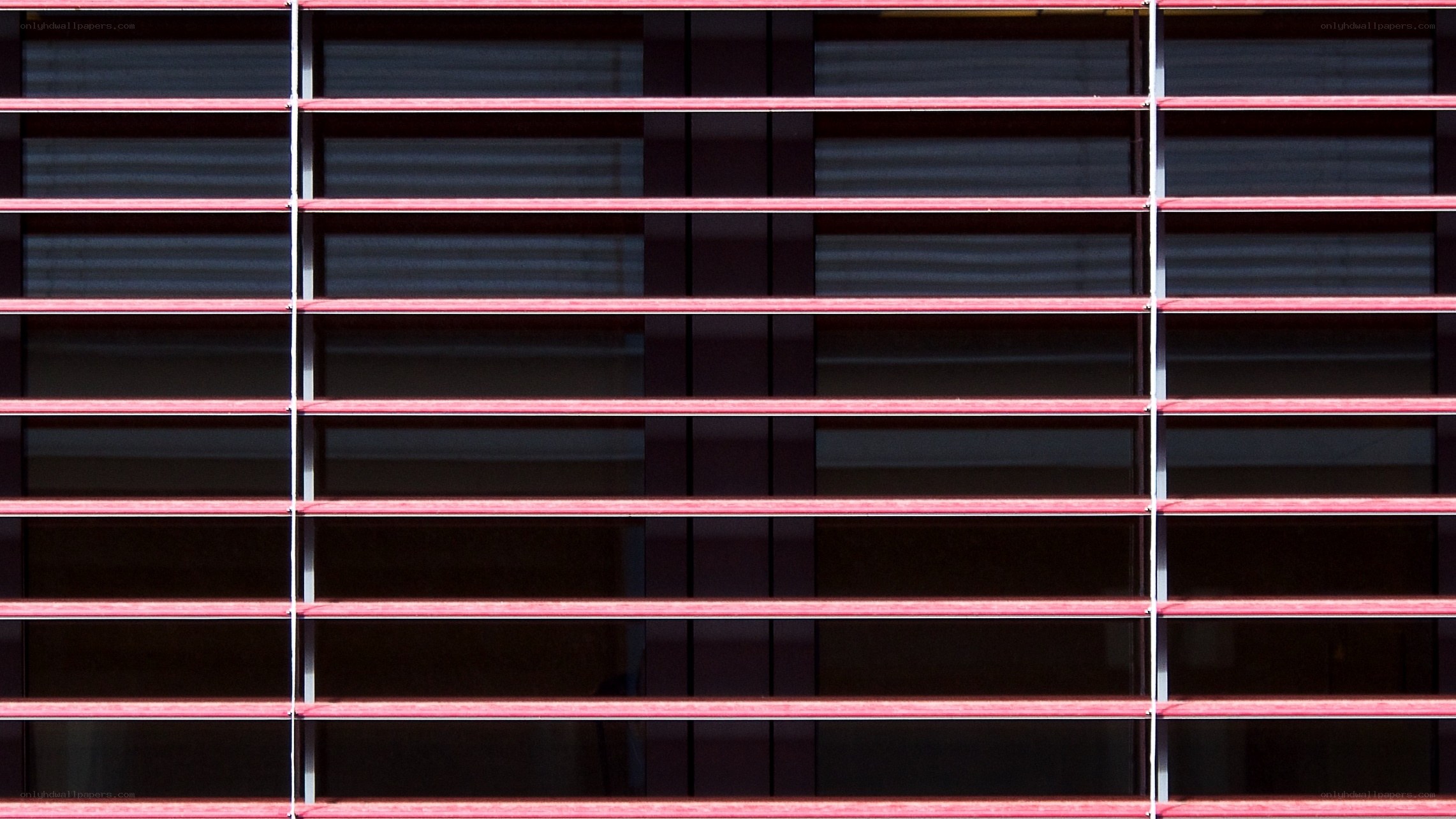 Red horizontal blinds on window