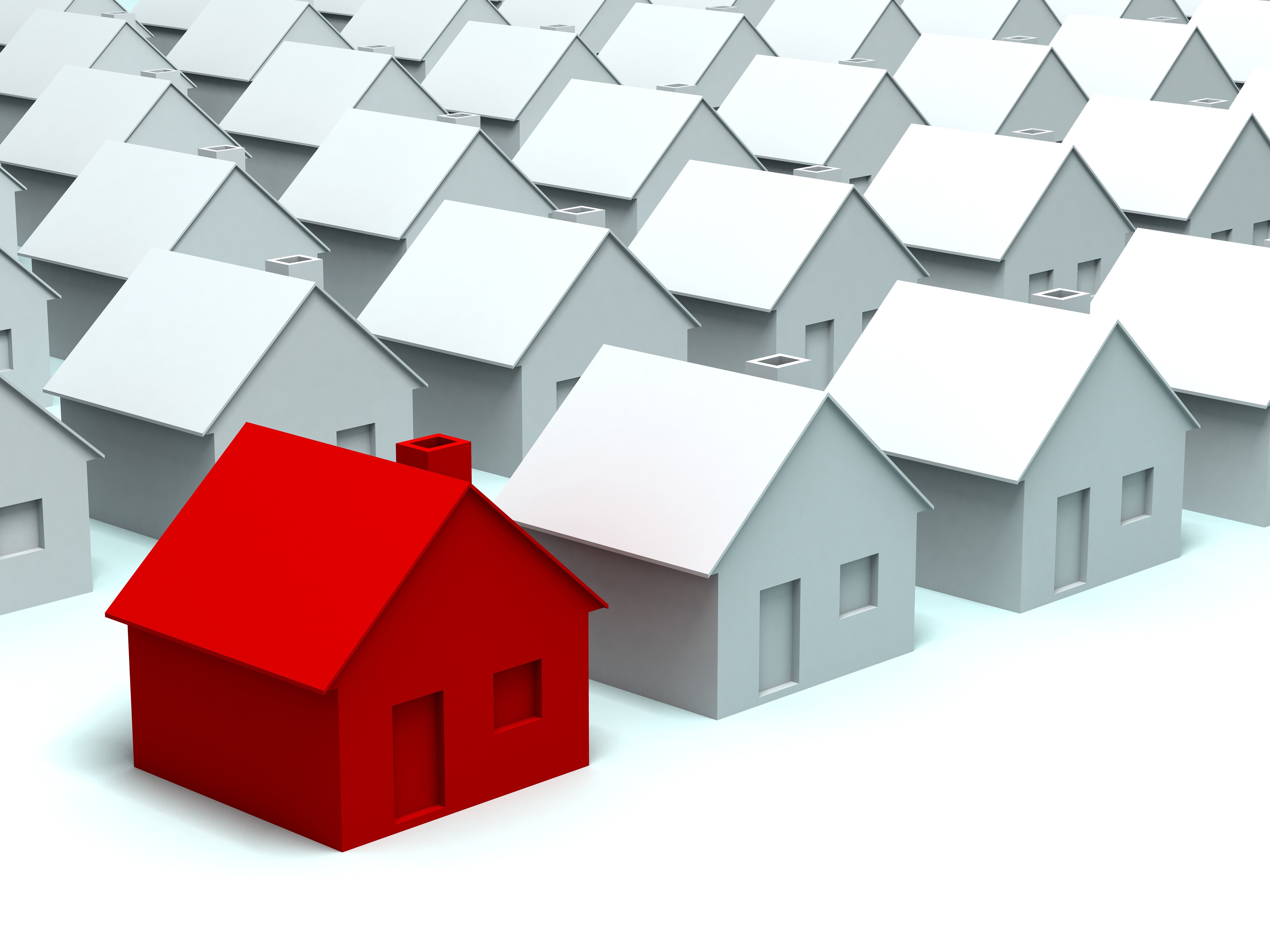 Red house among gray houses