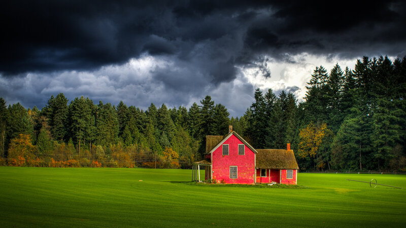 Red House in Field — Dramatic